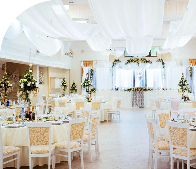 A large room with many tables and chairs.