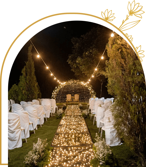 A wedding ceremony with lights and trees