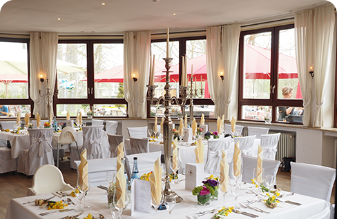 A large room with many tables and chairs