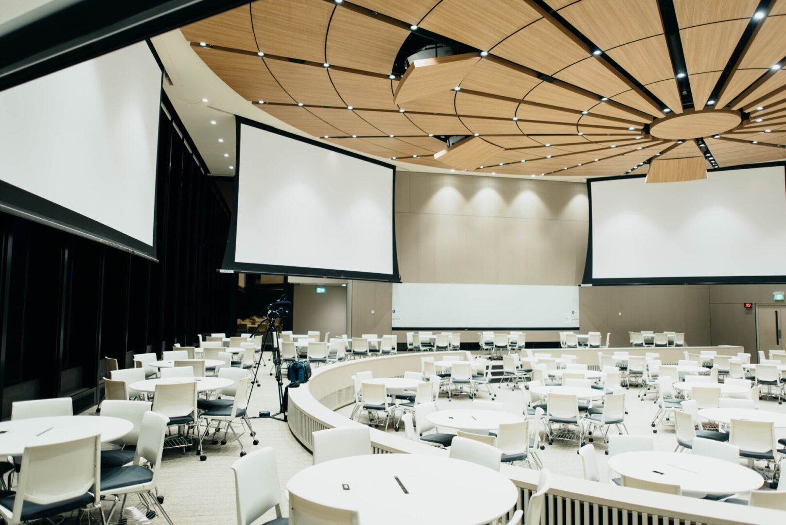 A large room with many tables and chairs