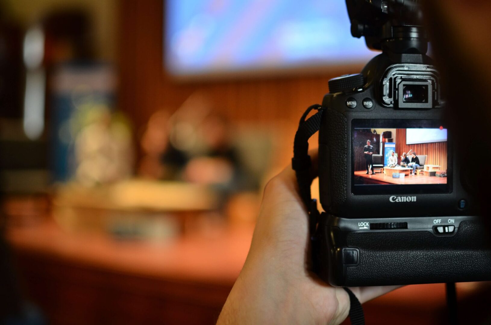 A person holding a camera in their hand.