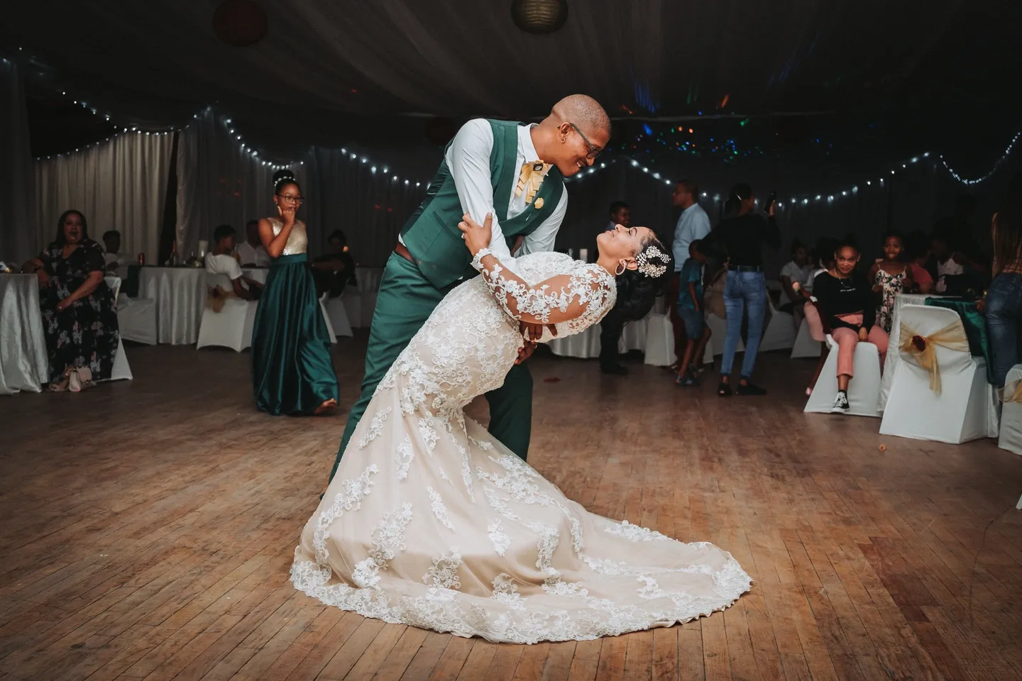 A man and woman dancing on the dance floor.