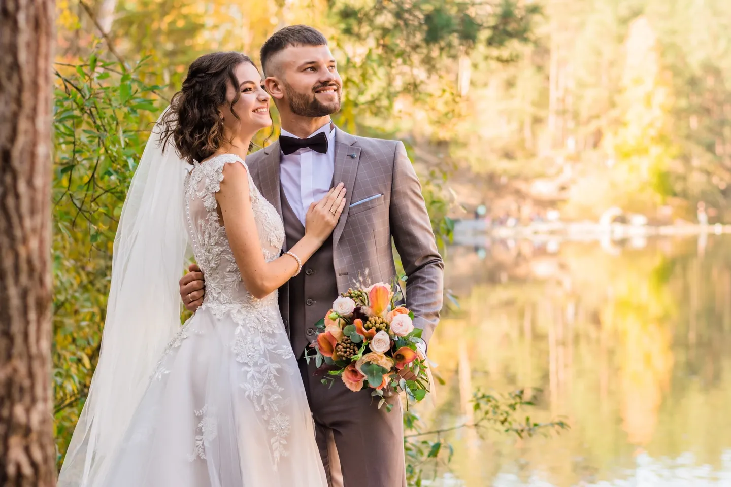 A bride and groom posing for the camera.